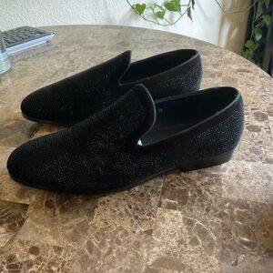 Men’s black formal dress shoe.